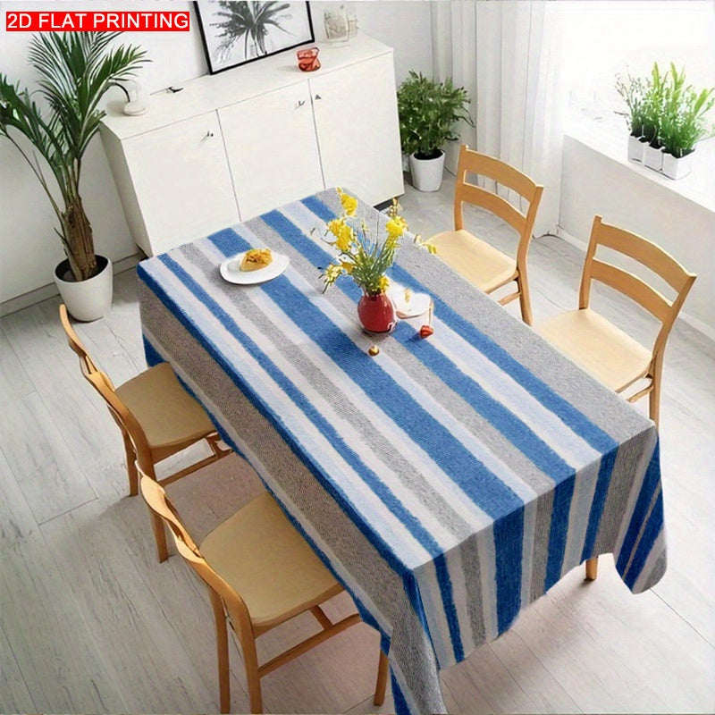 A Blue-Gray And White Striped Tablecloth, Perfect for Dining Tables, Coffee Tables, And Desks. It Serves As a Decorative Piece for Parties And Home Decor, Is Soft And Delicate, Machine Washable for Easy Cleaning, Enhances The Dining Atmosphere