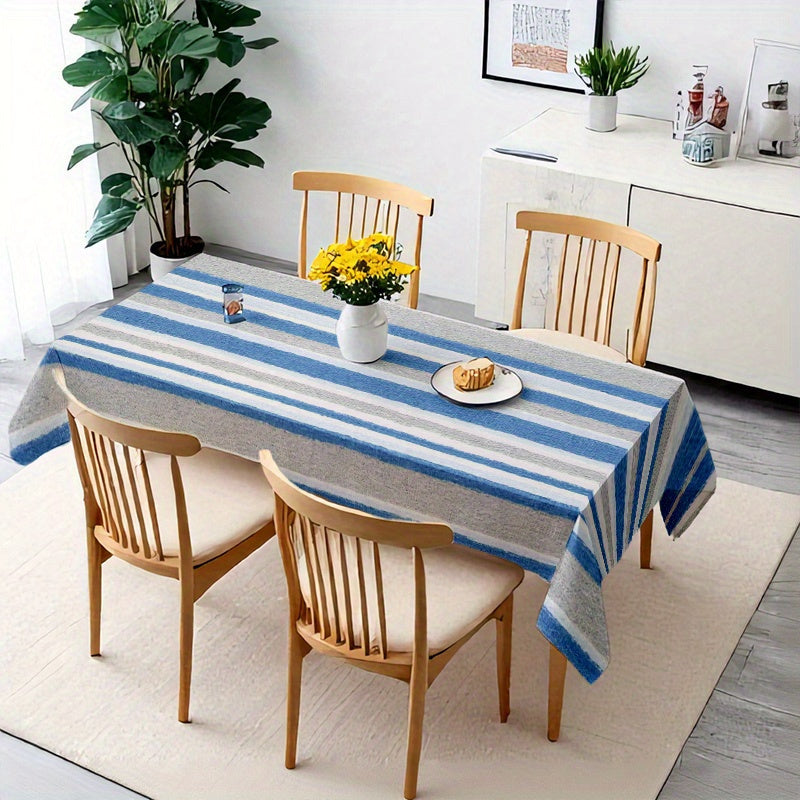 A Blue-Gray And White Striped Tablecloth, Perfect for Dining Tables, Coffee Tables, And Desks. It Serves As a Decorative Piece for Parties And Home Decor, Is Soft And Delicate, Machine Washable for Easy Cleaning, Enhances The Dining Atmosphere