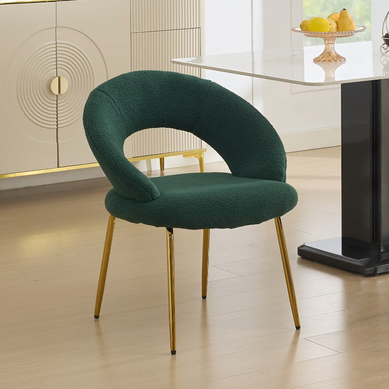 A Collection of One Green Upholstered Dining Chair Featuring a Curved Back And Golden Metal Legs, Suitable for The Kitchen Or Dining Area, Designed to Be Both Lightweight And Durable