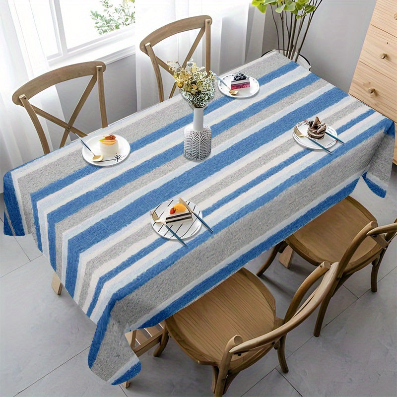 A Blue-Gray And White Striped Tablecloth, Perfect for Dining Tables, Coffee Tables, And Desks. It Serves As a Decorative Piece for Parties And Home Decor, Is Soft And Delicate, Machine Washable for Easy Cleaning, Enhances The Dining Atmosphere